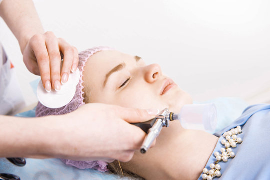 Cosmetologist performs the rejuvenation procedure
