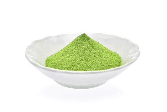 Powder green tea isolated on white background