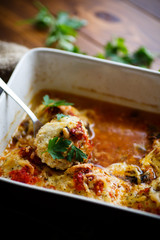 Fish meatballs baked in sauce