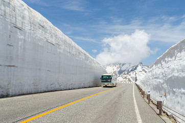 Blur windshield bus move along snow wall at japan alps tateyama kurobe alpine route