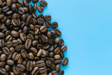 roasted coffee beans on the blue background