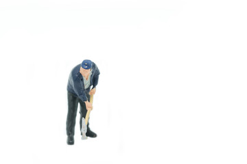 Miniature people Track workers concept on white background with a space for text.