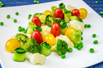 Fototapeta na wymiar Vegetables, tomatoes, cucumbers, peas and broccoli