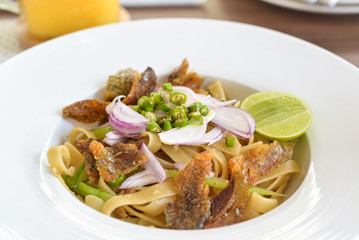 Linguine with crispy fish, chilli and lime, creative food