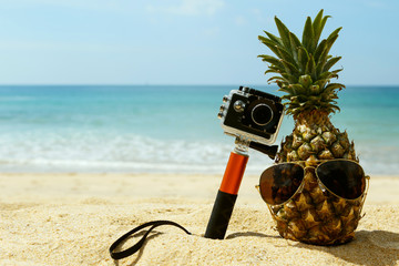 Pineapple, sunglasses and action-cam