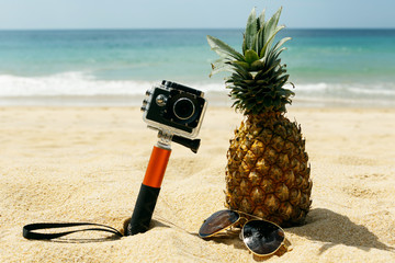 Pineapple, sunglasses and action-cam