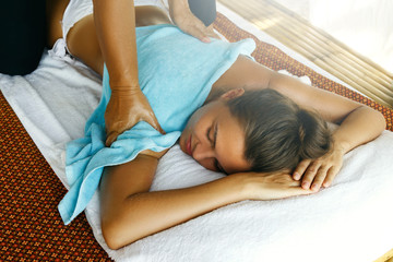 Woman during traditional Thai massage © blackday