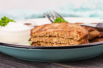 Liver Patties with Sour Cream and Parsley. Liver Cakes or Fritters of Liver. Healthy snack or take-away lunch bites.