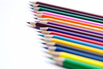 Photo of planed colored pencils on the light background