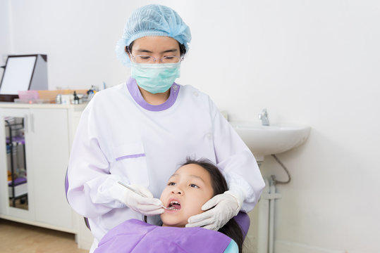 Dentist Examine Asian Girl Patient