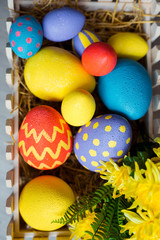 Colorful easter decorative eggs in wooden box