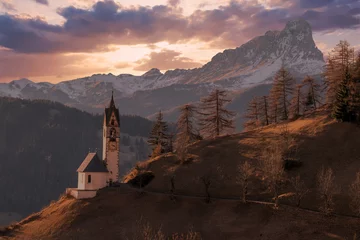 Foto op Plexiglas dolomites mountain church at sunset © Andrea Izzotti