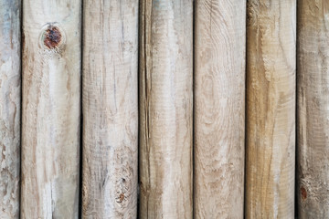 Wooden wall from logs as a background texture