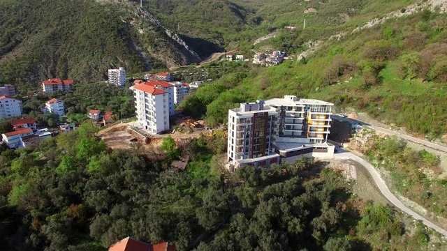 Multi-storey house in the mountains. Montenegrin architecture. Properties in the mountains of Montenegro. Aerial Photo Property drone.