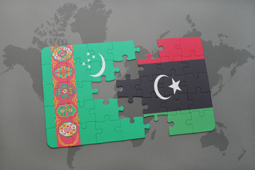 puzzle with the national flag of turkmenistan and libya on a world map