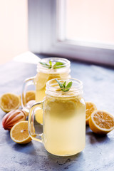 Fresh lemonade in mug jar with ice and mint Vertical photo 