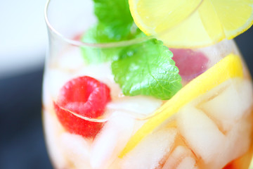 White wine with lemon, fresh raspberries and mint