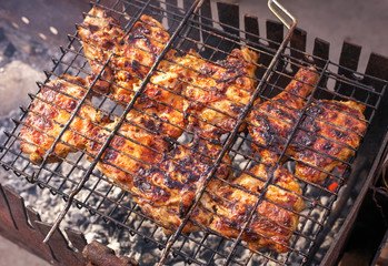 Pieces of chicken meat, roasted on the grill.
