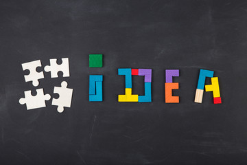 Business creative solution concept jigsaw on the blackboard
