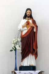 Sacred Heart of Jesus statue on the altar in Parish Church of Holy Trinity in Hrvatska Dubica, Croatia on November 18, 2010.
