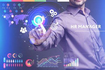 Business, Technology, Internet and network concept. Young businessman working on a virtual screen of the future and sees the inscription: HR manager