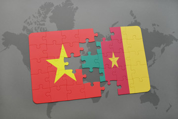 puzzle with the national flag of vietnam and cameroon on a world map