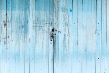 blue wood panel door close, aged paint old vintage wooden house door.