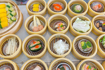 Yumcha or Dim sum, Chinese cuisine style steam food served in bamboo stack dish.