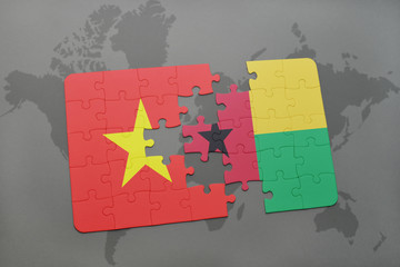puzzle with the national flag of vietnam and guinea bissau on a world map