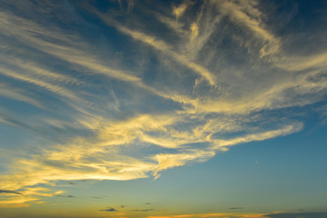 Beautiful fluffy clouds and orange clouds after sunset