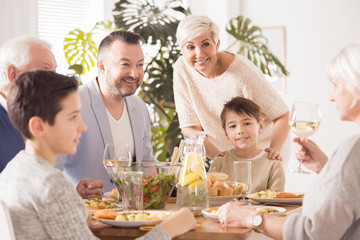 Obraz na płótnie Canvas Family eating meal together