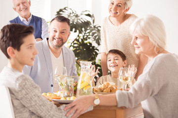 Obraz na płótnie Canvas Family eating festive dinner