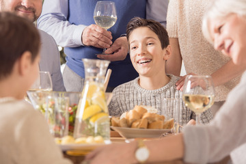 Happy boy celebrating with family