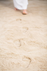 Fototapeta na wymiar Jesus walking leaving footprints
