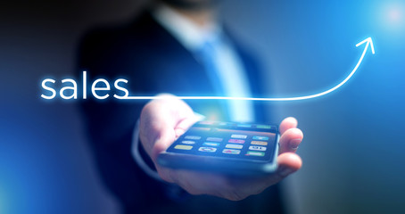 Concept of business success with arrow going up on a technology smartphone interface - Sales concept