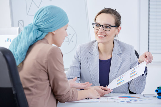 Doctor Showing A Chart To A Patient