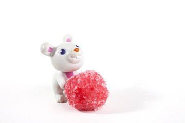 Bunny and candies together over a white background. Easter concept