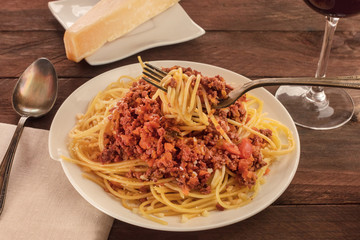 Plate of pasta with meat and tomato sauce
