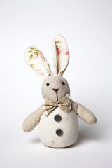 Cute bunny doll over a white background
