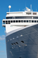 Modern cruise ship with a blue sky background