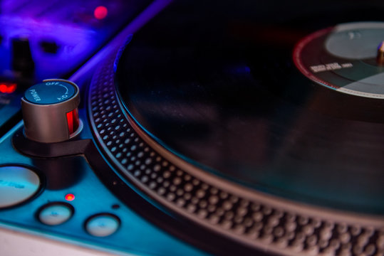 Close up Professional DJ audio equipment - turntable vinyl record player, selective focus.Sound technology for disc jockey to play at concert,party,event