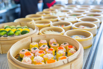 Yumcha or Dim sum, Chinese cuisine style steam food served in bamboo stack dish.
