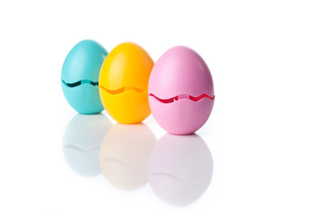 Colored Eggs over a white background