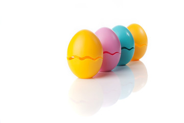 Colored Eggs over a white background