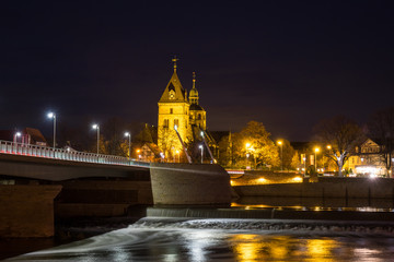Fototapeta na wymiar The night landscape on the river in Hamelin,Germany