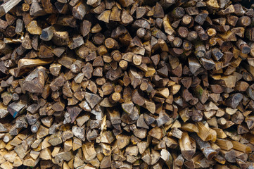 Firewood piled in stack outside