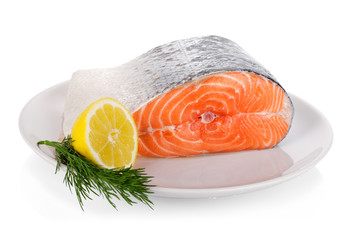 Raw steak of salmon on white plate isolated