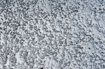 Surface hoar ice crystals formed on rockface in winter
