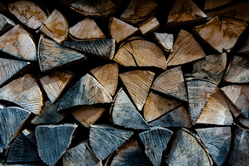 Firewood piled in stack outside