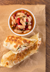 burrito with garnish of beans